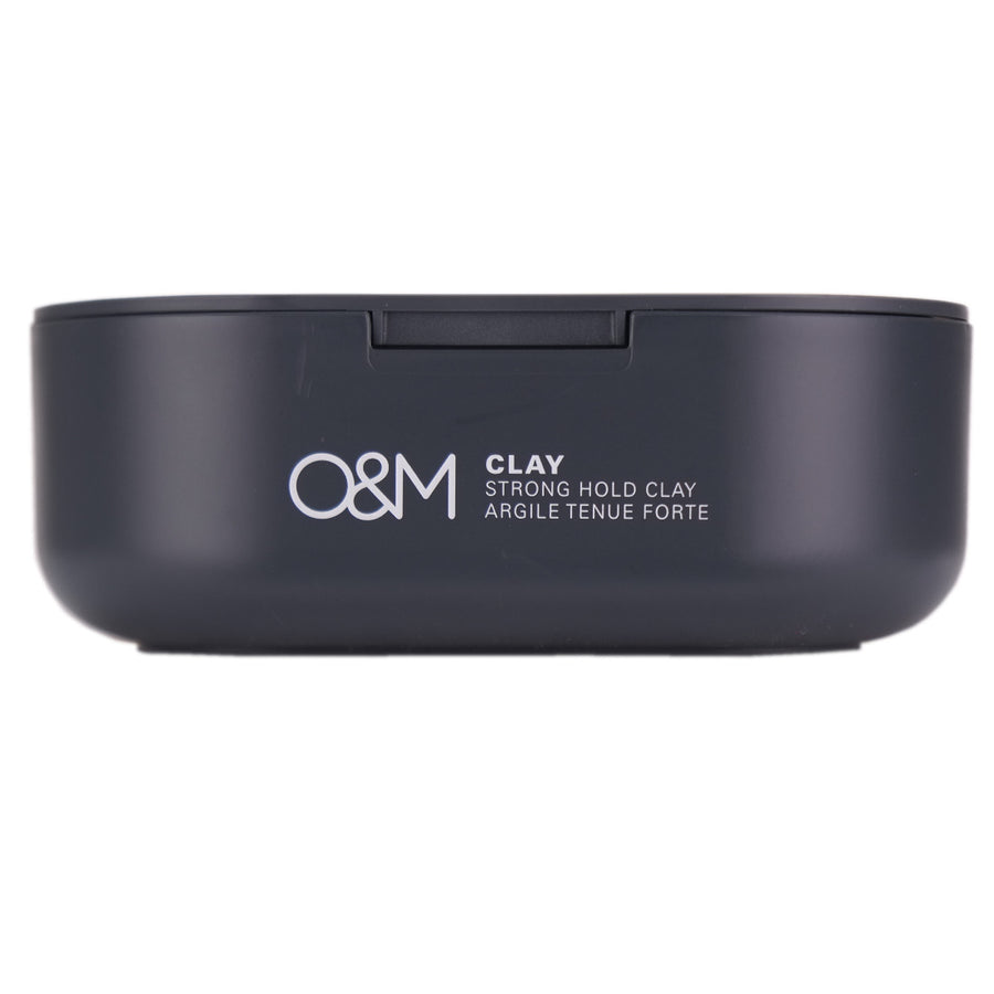O&M Clay Strong Hold helps smooth out unruly hair and provides all day hold with a matte finish.